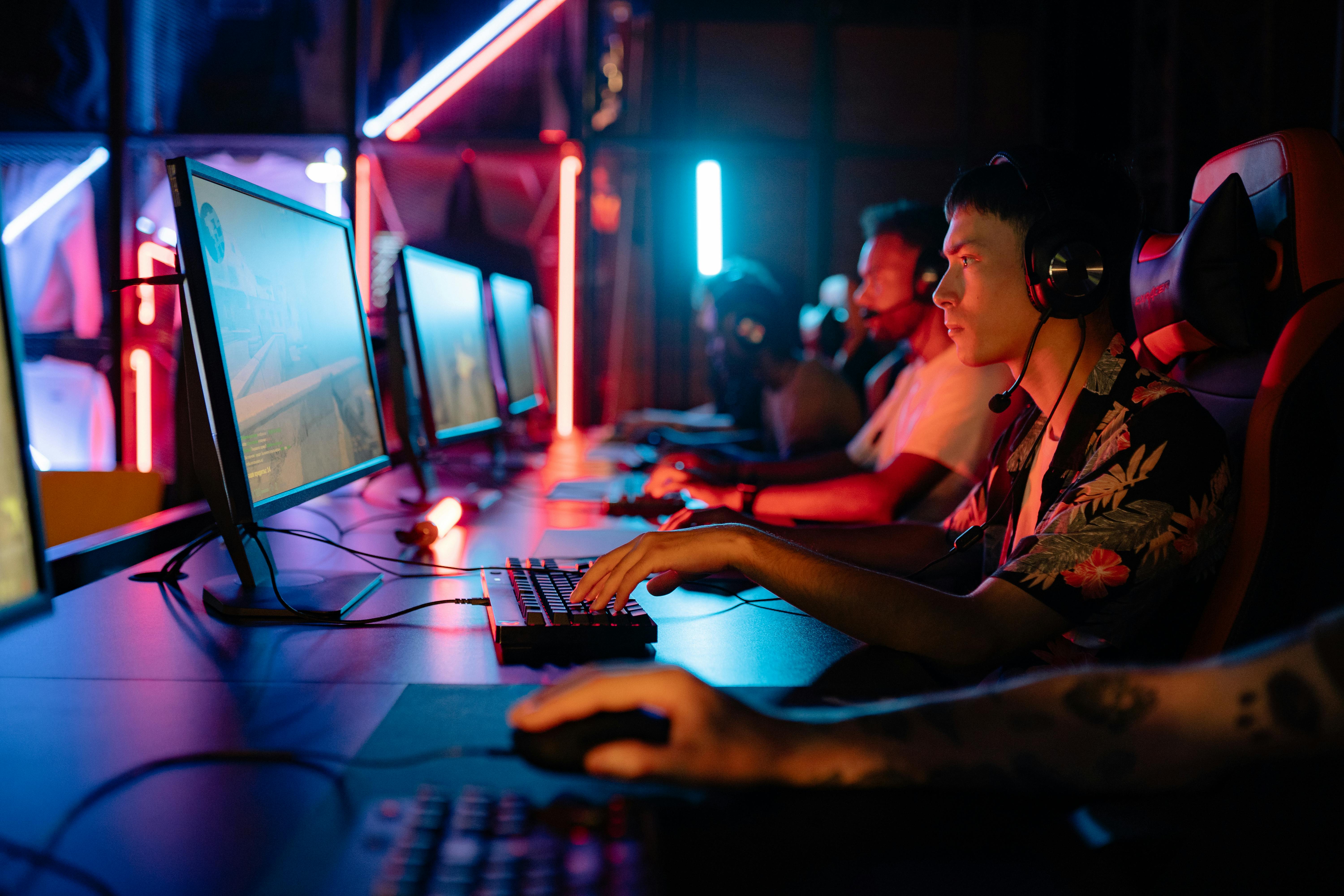 Collegiate esports athletes competing in a university gaming facility